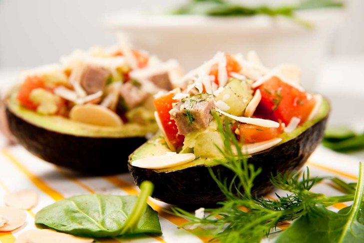 Small Appetizer Sized Paleo Salads Served in Halved Avocados