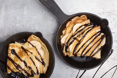 Crepes with bananas in skillet