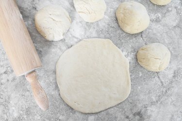 Roll out pizza dough