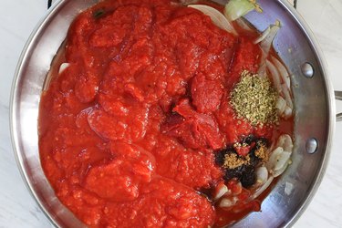 Cook tomato sauce