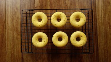 Healthy coconut flour low carb donuts on wire baking rack.