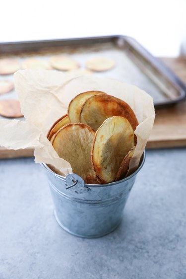 Baked potato chips in a small bucket