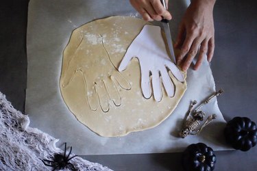 Cutting hand shape out of pie dough