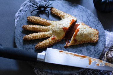 Severed hand meat pie with hot sauce