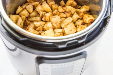 Apple butter ingredients stirred in instant pot
