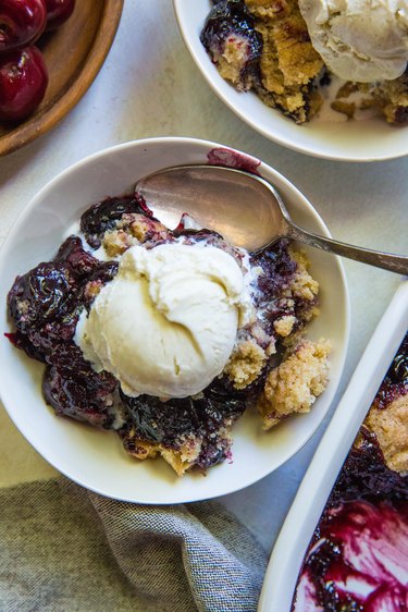 Cherry Cobbler in bowls with ice cream
