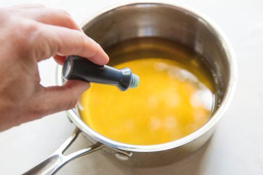 Adding food coloring to saucepan