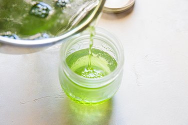Pouring mint jelly into jars