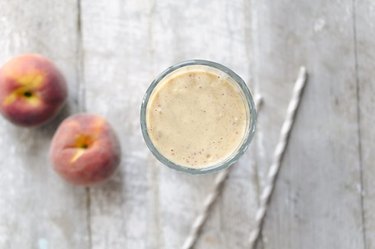 An aerial view of a peaches and cream smoothie.