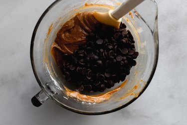 Put the chocolate chips into the dough bowl.